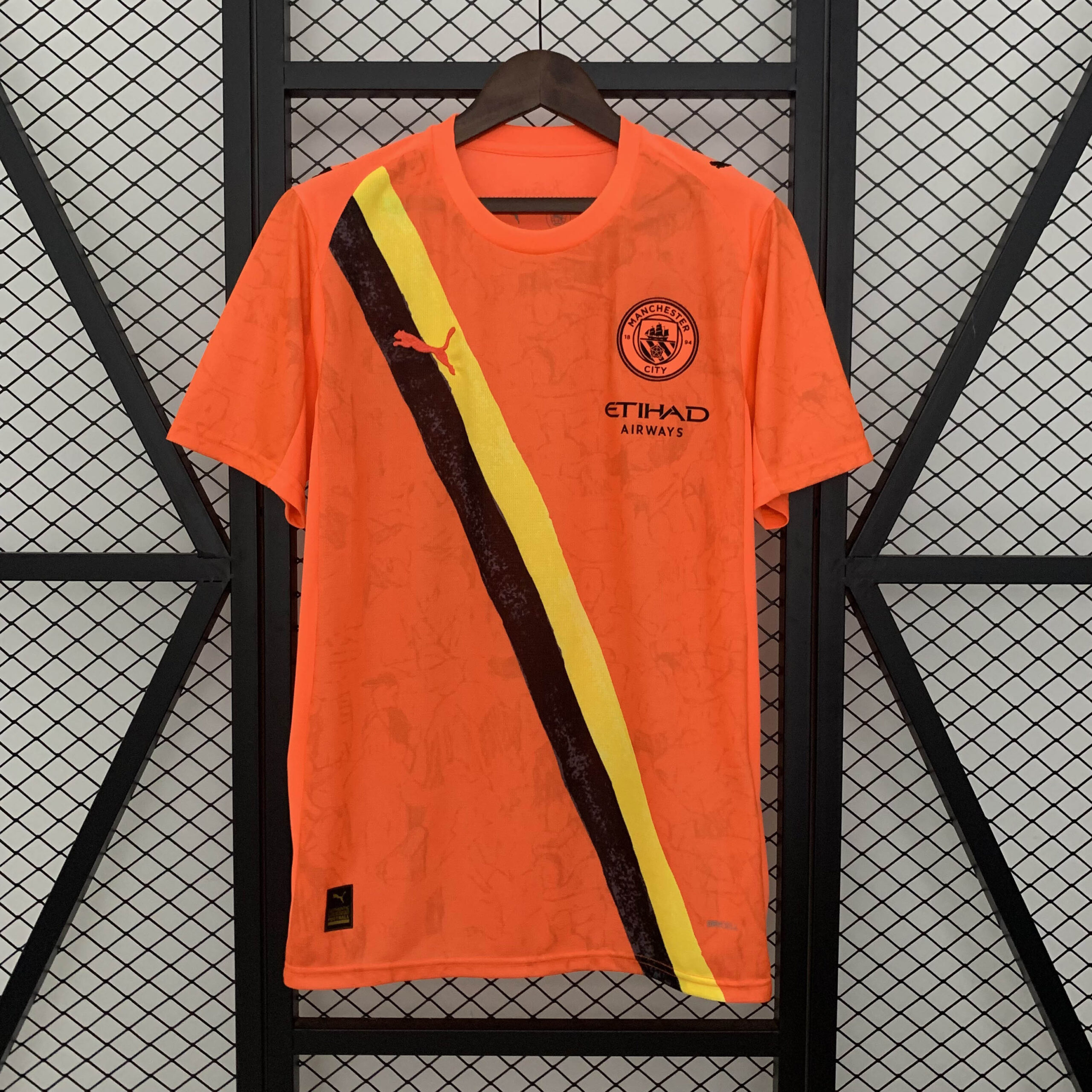 f2fffffd38e64cb6e44aa3f5ef42768925b428f5 2025/2026 Manchester City KidSuper Joint Edition Orange Football Shirt 1:1 Thai Quality - Image 1